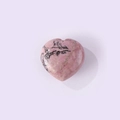 Pink heart-shaped natural stone pendant with dark veins on lavender background - Rhodonite with Black Lines
