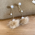 Detail showing plush brown pom-pom and elegant white pearl drop earring on wood surface - Brown Pom Pom Zirconia Style / Silver Earring Post-Gold-Coffee