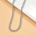 Detailed view of glossy silver Cuban link chain on a white ceramic display stand - 11# 5.4mm Flat Chain (1m)