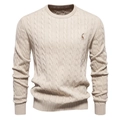 Detail of beige cable knit sweater showing deer embroidery and premium fabric texture - Apricot