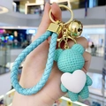Light blue woven leather keychain with heart bear pendant and golden metal bell charm - Green