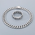 Close-up of polished 20mm silver titanium steel Cuban link chain necklace and bracelet set - Bracelet 22cm / Smooth Steel Color