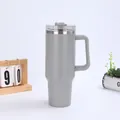 Detail of 40oz grey vacuum insulated tumbler showing ergonomic handle and lid - Gray (Generation 1)