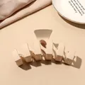 Macro detail of matte beige shark hair claw clip on pink silk background - Beige Matte-Wave