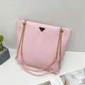 Pink woven chain tote bag for women with gold chain strap and black triangle logo - Pink