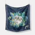 Artistic square silk scarf with moon and botanical prints hanging on a white wall - Blue