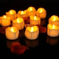 Romantic LED tea lights with warm yellow glow and rose petals on dark surface - Standard Function / Yellow Flickering