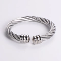 Detailed view of the twisted cable texture and polished ends of the silver steel cuff bracelet - Steel