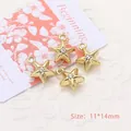 Detailed macro view of four golden star-shaped charms with rhinestones for DIY jewelry making - Star / Gold