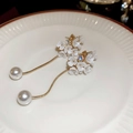 Macro detail of floral tassel earring with white flowers and pearls on ceramic tray - 27# White Rhinestone Flower