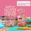 Transparent strawberry gift bag with red bow pattern and golden twist ties - Burgundy Cherry Style - Extra Small