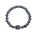 Detailed view of beaded bracelet with dark metallic spheres and a black rectangular stone - Magnetic Stone & Shiny Black Beads With Tourmaline