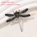 Silver dragonfly brooch with black enamel wings and amber eye beads, 1.77x2.01 inches - Dragonfly Style (YNCP2819)