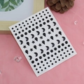 Black adhesive facial rhinestones with stars, moon, and drop shapes on pink mesh - Black Moon & Star Gems
