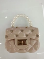 Pink diamond-quilted jelly bag with pearl handle and gold twist-lock closure - Apricot