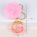Pink faux fur pompom keychain with gold foil resin letter G pendant and gold clasp - Letter G