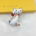 Cute white enamel cat brooch with colorful patterns and floral details on golden base - White Patterned Cat