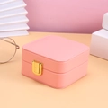 Pink velvet jewelry organizer box with gold lock and elegant white stitching accents - Pink