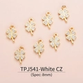 Detailed macro view of 8mm clover charm with white zircon in 18K gold plated copper - Four-leaf Clover (8mm) / White