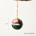 Green metal Santa Claus bell with star cutouts and hemp rope for Christmas decor - Green Santa Bell