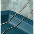 Macro shot of gold box chain necklace with dense square link structure on elegant display - 50 cm / Box Chain (Gold)