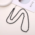 Crossbody black acrylic link phone chain with metal clasps on a stylish white setup - Crossbody Chain / Black