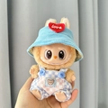 Brown Labubu plush toy in blue corduroy hat and checkered overalls with bear pocket - Blue And White Checkered Overalls + Red Heart And Blue Hat / First And Second Generation Keychains Are Compatible With La Cloth Dolls. Dolls Not Included.