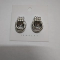 Elegant silver entwined triple ring stud earrings displayed on a white jewelry card - 15.6X23.3 Small Silver Style