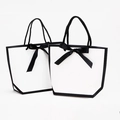Minimalist white trapezoid gift bag with black trim and a silk ribbon bow accent - 14*7*13cm / White Black Edge