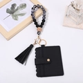 Detail of black leather card holder with marble silicone beaded wristlet and tassel keychain - Black