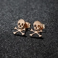 Rose gold stainless steel skull and crossbones stud earrings on grey background - 434 Rose Gold (Skull)