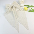 Detail of cream chiffon oversized hair bow with flocking polka dots and long ribbons - Off White