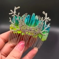 Detailed shot of silver moon and branch hair comb with teal crystal stones - Yellow Green + Branch + Moon