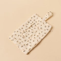 Close-up of baby crib hanging wipe bag with yellow floral pattern on soft cotton muslin fabric - Black & Yellow Floral