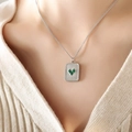 Silver square pendant necklace with green heart zircon worn on a model's neck - 40+5cm / Steel Color Green Glass Stone Necklace