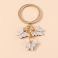 Llavero de mariposa blanco con purpurina y aro dorado para bolsos y accesorios - Brillo Blanco Plateado (YZ172yinbai)