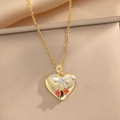 Collana a cuore in acciaio al titanio dorato con pendente a ciliegia e fiocco argento - Oro (435 Collana Cuore Ciliegia Oro)