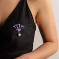 Blue fan-shaped enamel brooch with bamboo design and pearl pendant worn on black clothing - Blue Fan Bamboo Style (11205)