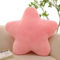 Detailed view of a soft pink star-shaped plush pillow on a cozy beige sofa with a book - 30cm-125g / Pink