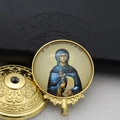 Detail of gold-plated Saint Parascheva religious medal and threaded decorative cap - Gold-9 (St. Parascheva Figure)
