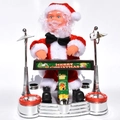 Electric musical Santa Claus sitting on a silver drum set toy with festive banner - Piano Stage Santa