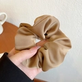 Elegant champagne gold satin scrunchie with smooth silk texture and soft puffy design - Khaki