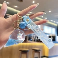Blue unicorn liquid sand keychain featuring an ice cream cone and a Happy Moments strap - Blue-Ice Cream Unicorn