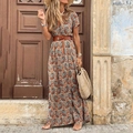 Bohemian paisley V-neck maxi dress with wide brown belt shown in vintage street setting - S / Brown