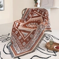 Bohemian geometric woven blanket in earth red with fringe on a rattan chair - XT2022-16 (Rustic Red Ethnic) / 160*130CM