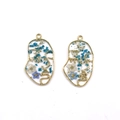 Detail of face silhouette resin pendants with gold frames and real dried flowers - Blue Face