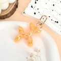 Colorful orange gradient balloon dog keychain with golden lobster clasp and resin finish - Iridescent Orange