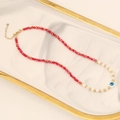 Evil Eye Muschel Halskette mit roten Perlen auf weißem Marmortablett mit Goldrand - 1# Rote Halskette