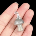 Gray crystal mushroom pendant with silver metal wizard hat accessory on hand - Gun Black Cap / Labradorite