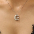 Silver opal sun and moon pendant necklace with cubic zirconia on a female model - Silver Moon Star Rhinestone Style (A-1284)